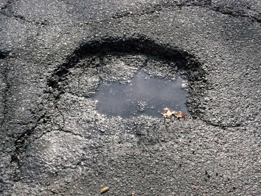 pothole Potholes are everywhere this March.